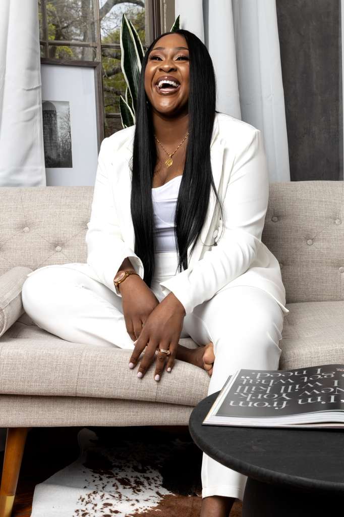 Tomilade Adebari in a white suit